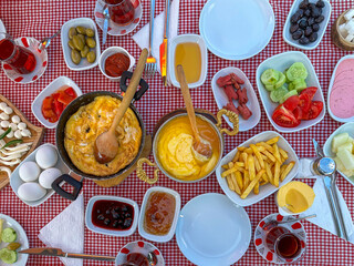 Turkish breakfast with pastries and sausage.