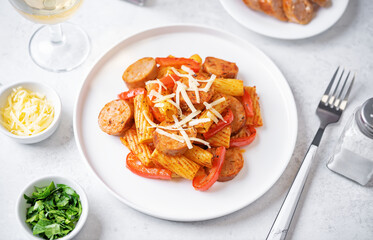 Meat sausage tomato sauce pasta in a bowl
