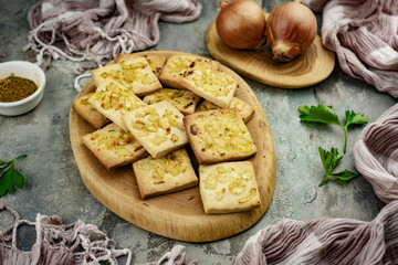 Onion cookies with cheese for breakfast. Close-up