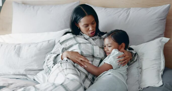 Bed, hug and mother with child with parent love, support and care in a home. Mom, young kid and smile with embrace and bonding in a house together with family in a bedroom feeling happy and relax