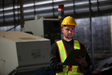 worker or engineer working in factory with safety uniform , safety hat and safety glasses , image is safety concept or happy workplace