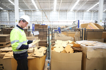 worker or engineer working in factory with safety uniform , safety hat and safety glasses , image is safety concept or happy workplace