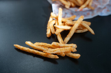 French fries in black background