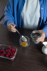 Healthy vegan dessert - chia pudding with mango and berries. Home cooking.