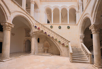 Fototapeta na wymiar Atrium and staircase inside Rector's Palace in old town of Dubrovnik. The palace was used to serve as the seat of the Rector of the Republic of Ragusa between the 14th century and 1808.