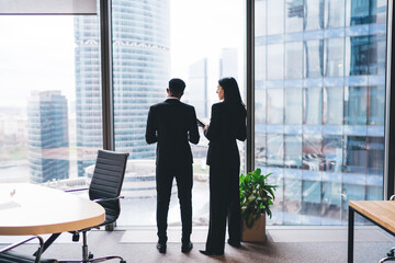 Businesspeople discussing project in modern office