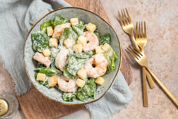 Fresh caesar salad on bowl with parmesan cheese and shrimps - obrazy, fototapety, plakaty