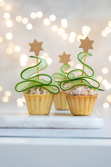 Christmas tree canape with cucumber slice and salmon pate