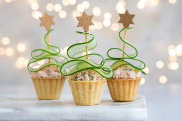 Christmas tree canape with cucumber slice and salmon pate