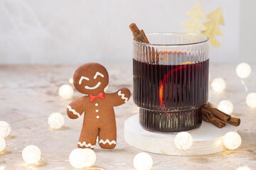 Spiced citrus mulled wine on white linen surface
