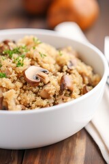 Vertical photo of a portion of quinoa cooked with mushrooms. Generative AI