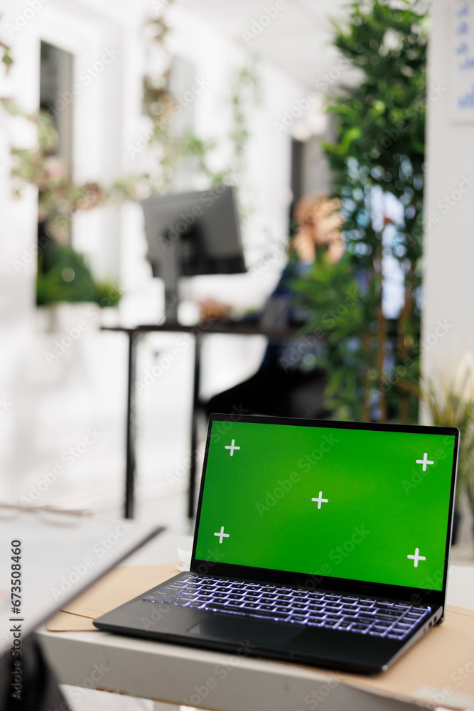 Aufkleber laptop with chroma key green screen on desk in business office for financial presentation mock up. p