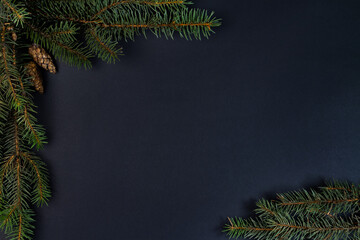 Fototapeta na wymiar A Christmas tree, decorations on a black background. Top view.