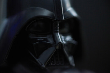 Fototapeta premium Star Wars toy doll Darth Vader, a legendary and imposing villain from the dark side of the Force. 2023 Edition photographed October 13, 2023.