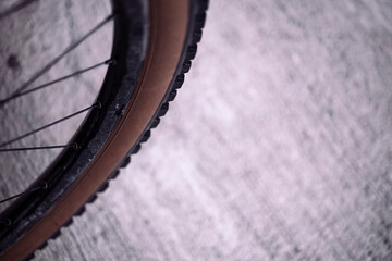 Tan wall mountain bike tyre on a black rim wheel