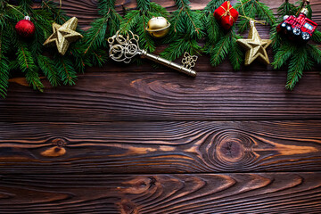 Festive Spruce Branches and Key on Wooden Background. A Symbol of Welcoming the New Year, Home...