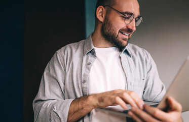 Focused male entrepreneur typing on computer during workday