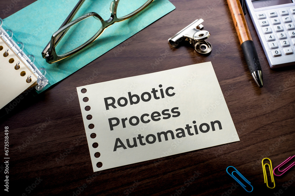 Poster there is notebook with the word robotic process automation. it is as an eye-catching image.