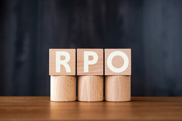 There is wood cube with the word RPO. It is an abbreviation for Recovery Point Objective as eye-catching image.