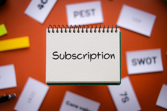There is notebook with the word Subscription. It is as an eye-catching image.