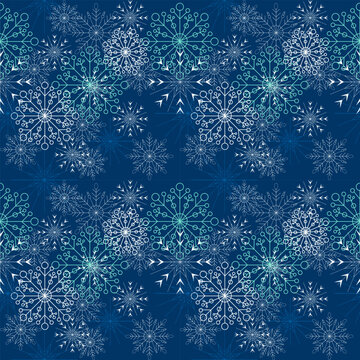 Seamless Christmas pattern of many snowflakes and blue background.