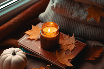 Lit Candle Casting a Warm Glow, Surrounded by the Rich Tapestry of Fall's Fading Leaves, Bountiful...