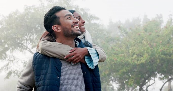 Couple, piggy back and love in the park with a smile, happy date or people together for fun in nature, woods or walk in the forest. Friends, Indian woman and man have quality time to play on vacation