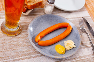 Two delicious thin parboiled sacher sausages traditionally served as beer snack with horseradish...
