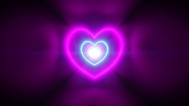 Seamless loop background with flying through the dark tunnel with neon hearts. Blue and pink valentine's heart shines bright with fluorescent light. Concept for celebrating saint valentine's day.