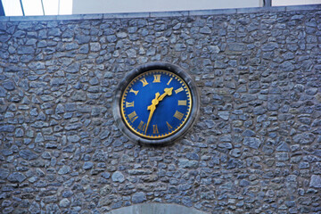 clock on the wall of the church