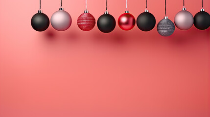 Christmas ornaments in red and black with space for text isolated pastel background Copy space