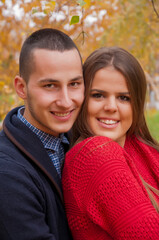 Autumn romance between two teenagers in the public park