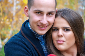 Autumn romance between two teenagers in the public park