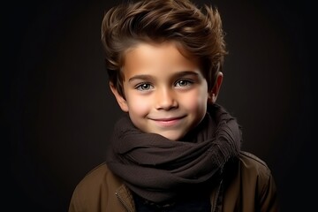 Portrait of a cute little boy in warm clothes. Studio shot.