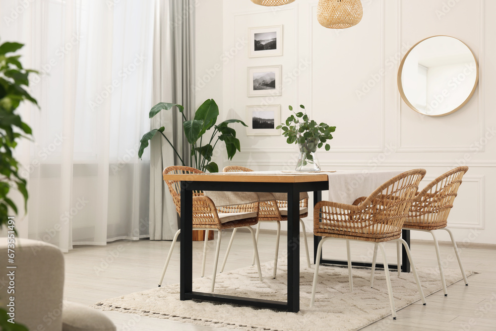 Sticker Stylish dining room with cozy furniture, mirror and plants