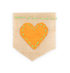 Piece of burlap fabric with heart isolated on white, top view