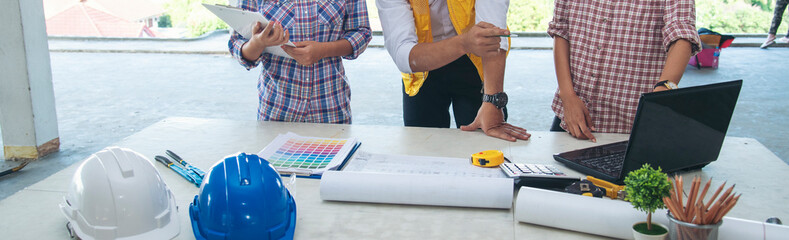 Banner asian engineer man brainstorming teams partner meeting office desk on construction site....
