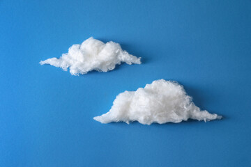 Clouds made of cotton on blue background