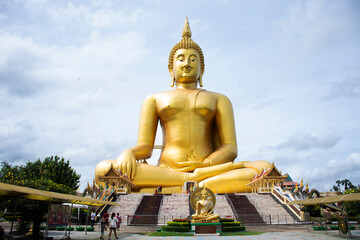 Ancient golden big buddha statue for thai people travelers travel visit and respect praying...