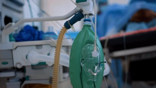 Bag valve mask hanging on the apparatus in surgery room. Close up. Blurred backdrop.