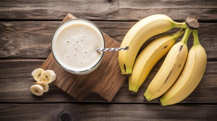 some bananas are sitting beside a glass of milk and some chocolate