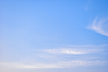 beautiful blue sky and white fluffy cloud with sunrise in the morning, natural background