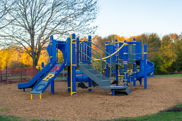 Unidentified typical elementary school playground with engineered wood fiber safety fall surface	