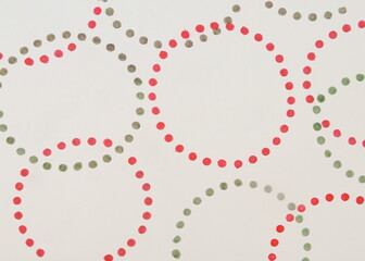 Circular Design of Red and Green Dots on White Background in Watercolor