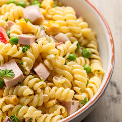 Pasta salad with vegan lyon sausage, pickles and vegetables