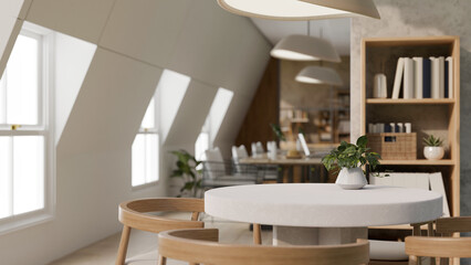 A beautiful, cosy office lounge or co-working space with a table. Empty mockup space on a table.