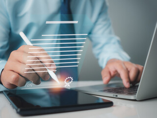 Businessman use electronic pen sign signature on electronic E-signing, data sheet document management, Electronic signature and paperless office concept.