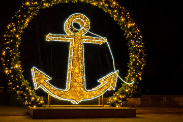 Ship Anchor Holiday illuminated decorations in Gdansk Poland. Beautiful Christmas fair at night....