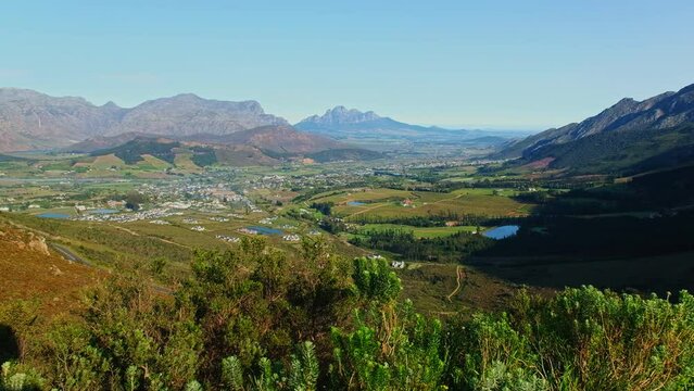 Picturesque Franschhoek valley nestled between towering mountains, high angle