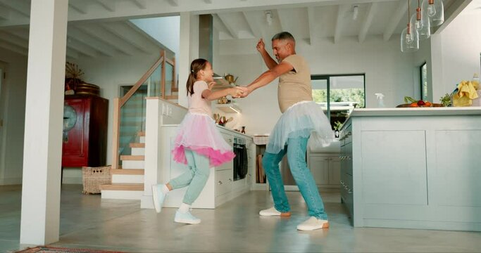 Dad, girl and ballet with dancing, home and tutu with playing, care and bonding together in kitchen. Happy father, young daughter or ballerina with comic game, art and creativity in family house